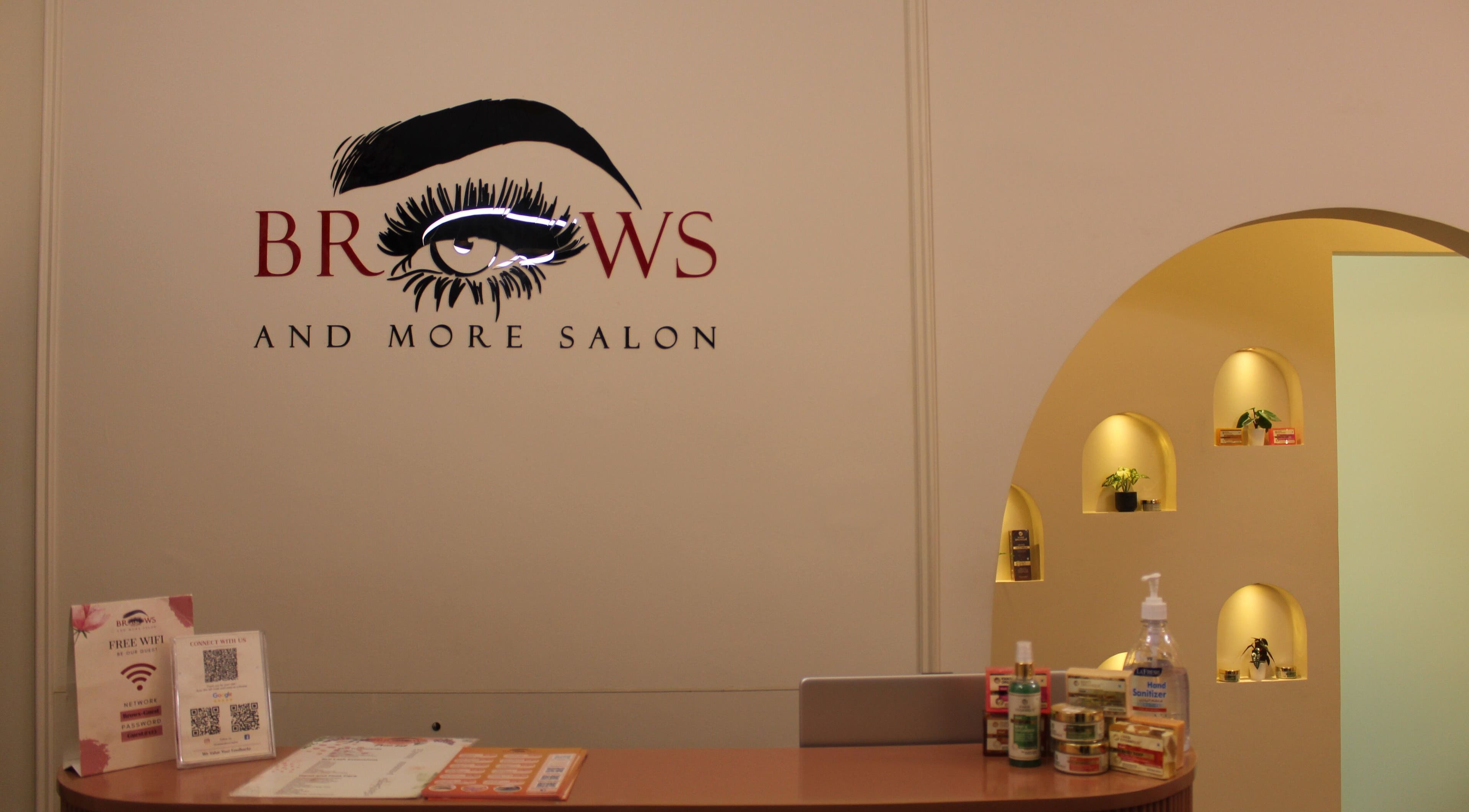 Reception of Brows and More (Karama) in Dubai, Dubai, AE featuring stylish signage and beauty products.