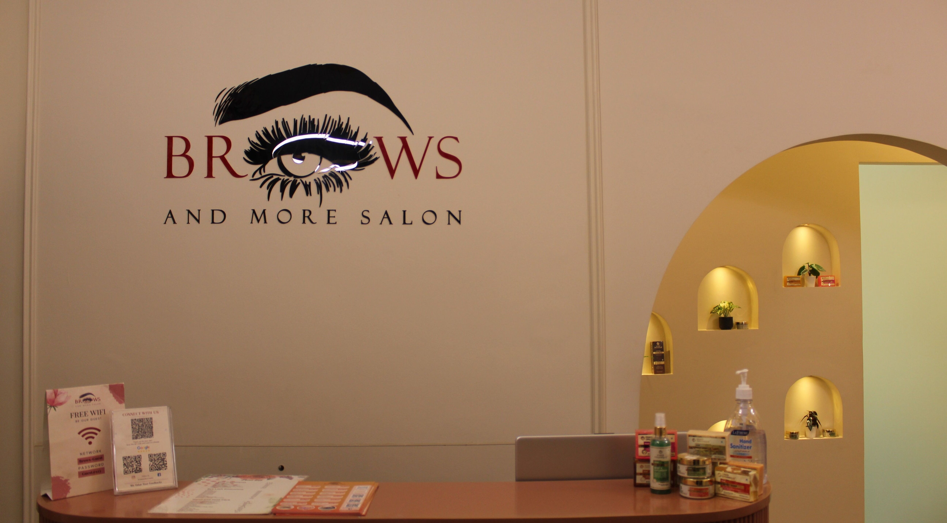 Reception of Brows and More (Karama) in Dubai, Dubai, AE featuring stylish signage and beauty products.