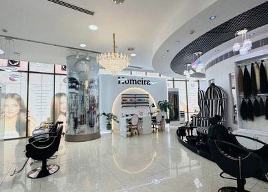 Elegant interior of Homeira Ladies Salon L.L.C in Dubai, Dubai, AE showcasing chic styling chairs and decor.