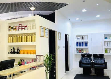 Interior of Homeira Ladies Salon L.L.C, Dubai, Dubai, AE featuring stylish decor and hair care stations.