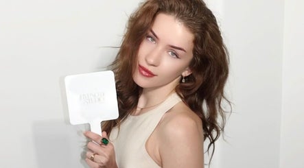 Woman holding a Hypnotic Studio Wyndham Vale mirror, Melbourne, Victoria, AU.