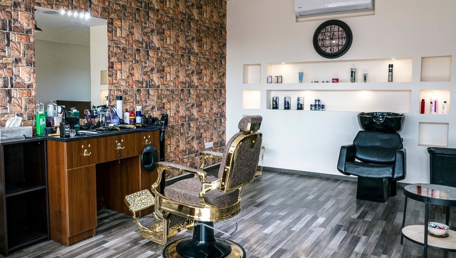 Stylish interior of Mankind Men's Hair Studio by Nikolas Potsos in Limassol, Limassol, CY with barber chair and products.