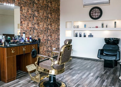 Stylish interior of Mankind Men's Hair Studio by Nikolas Potsos in Limassol, Limassol, CY with barber chair and products.