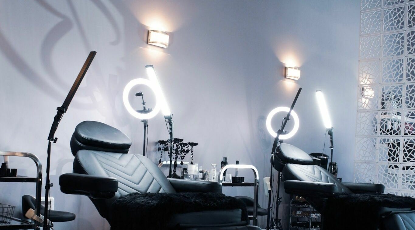 Demure Beauty and Academy Ltd's chic interior at Shawnigan Lake, BC, CA featuring modern beauty chairs and lighting.