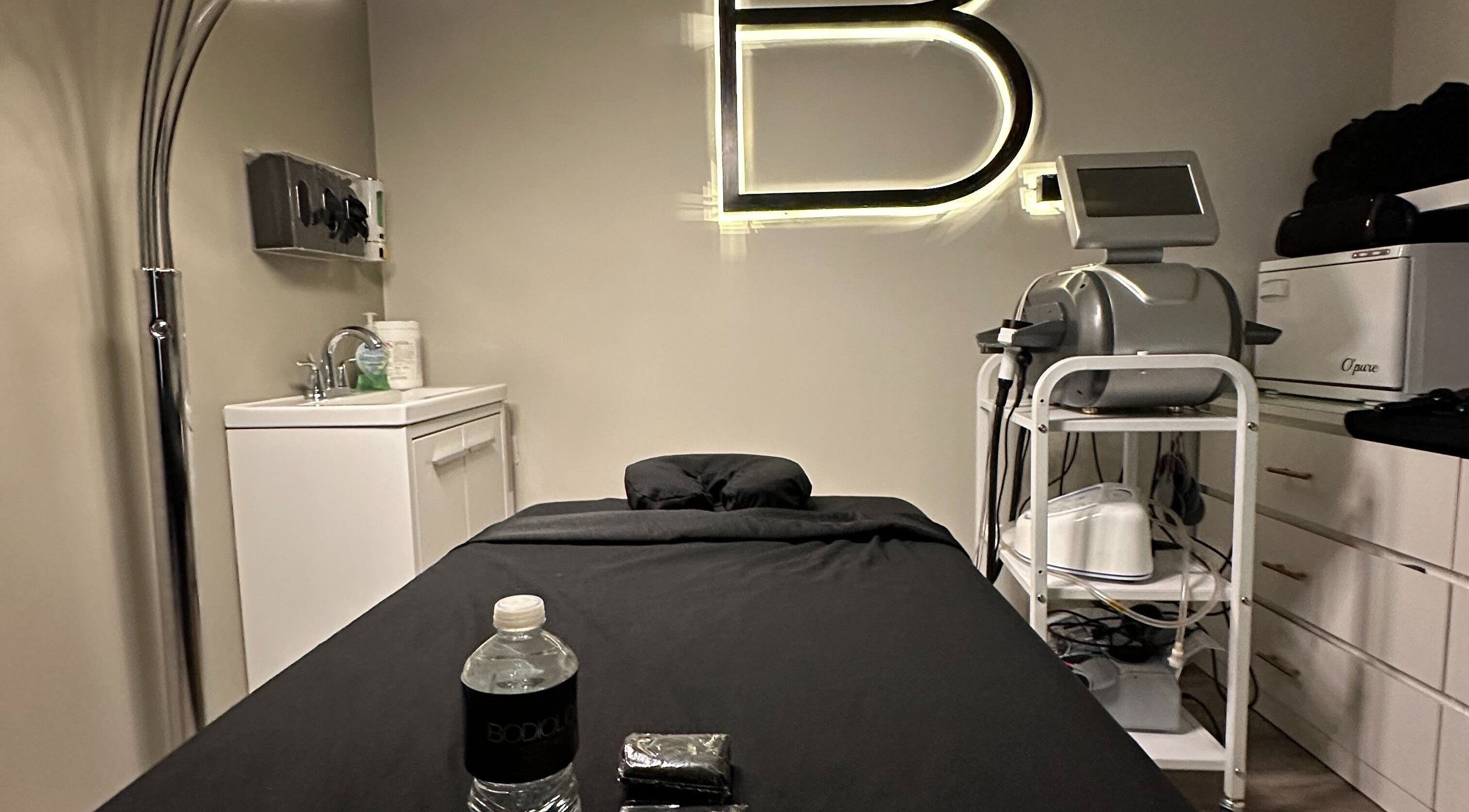 Bodiology Aesthetics' calming treatment room in Calgary, Alberta, CA, offering a relaxing wellness experience.