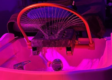 Vibrant pedicure setup at SAHD Spa Clinic, Newcastle Upon Tyne, England, GB, with relaxing ambient lighting.