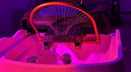 Vibrant pedicure setup at SAHD Spa Clinic, Newcastle Upon Tyne, England, GB, with relaxing ambient lighting.