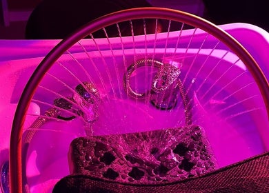 Luxurious foot spa at SAHD Spa Clinic, Newcastle Upon Tyne, England, GB under calming pink light.