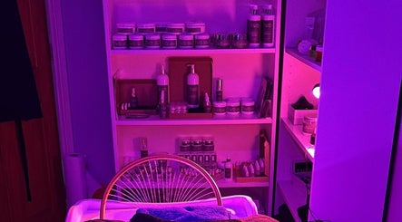 Relaxing spa shelves at SAHD Spa Clinic - Chopwell, Newcastle Upon Tyne, England, GB with purple ambiance lighting.