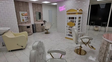 Elegant salon interior at SAHD Spa Clinic - Stanley in Stanley, England, GB with luxury chairs and neon decor.