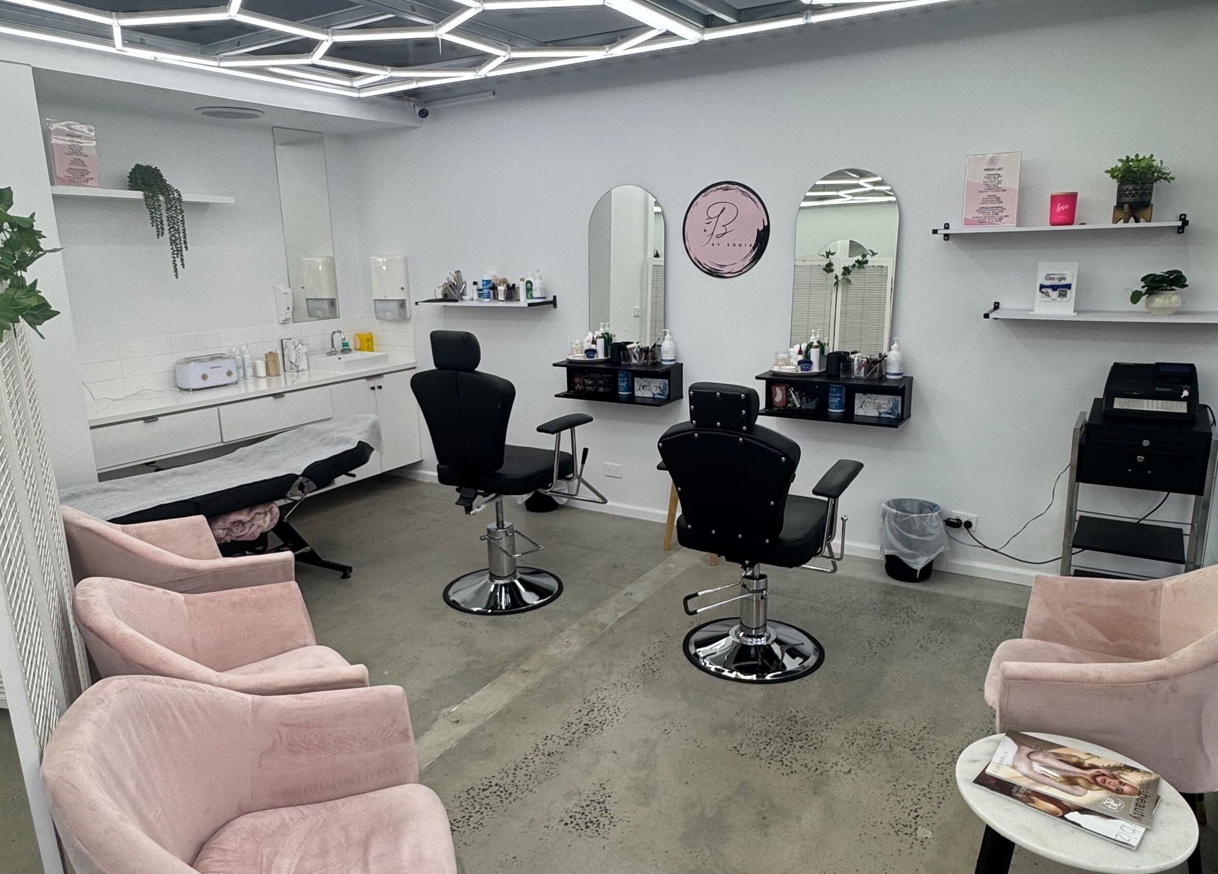 Modern interior of Brows by Sonia beauty salon in Melbourne, Victoria, AU with stylish seating and vanity.