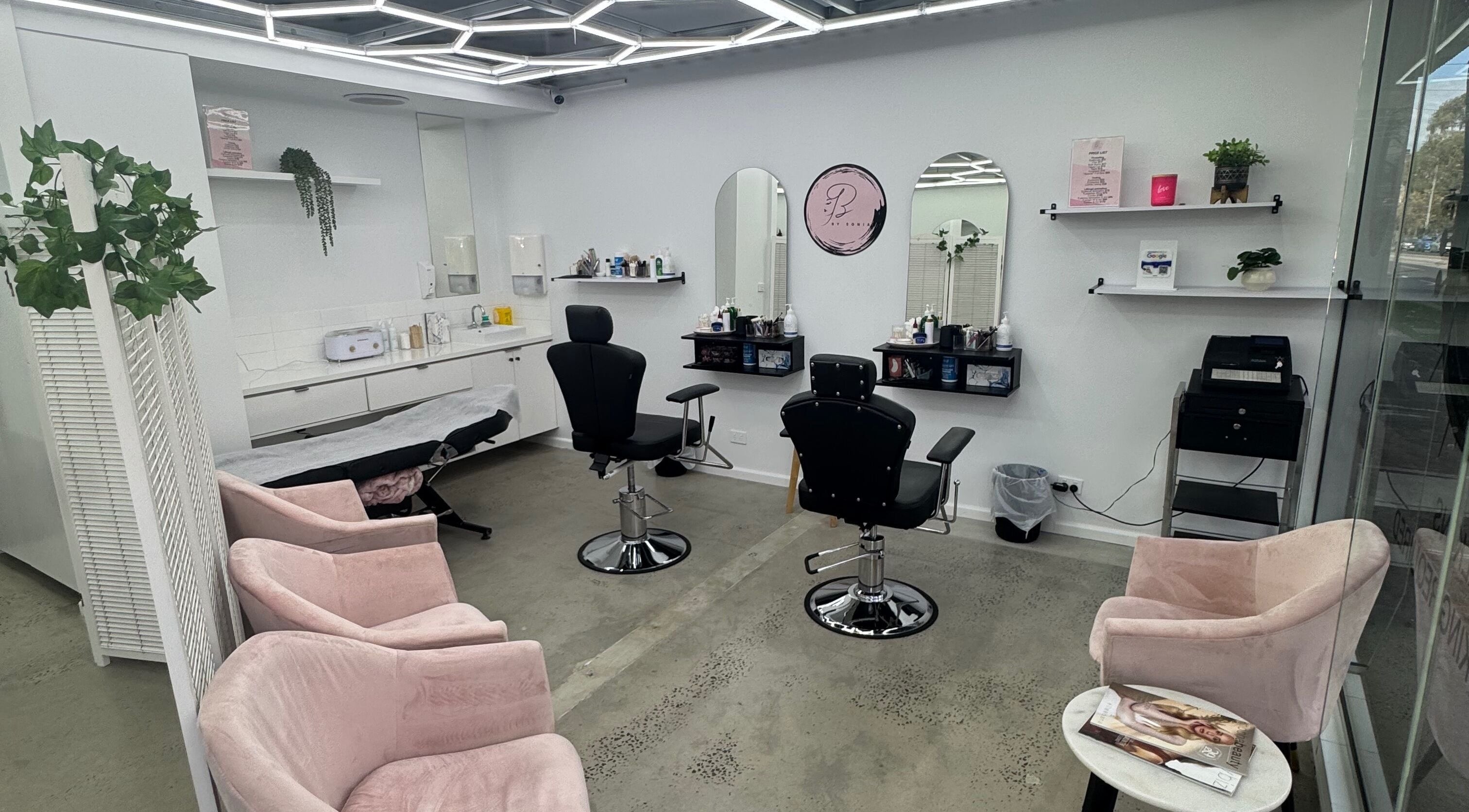 Modern interior of Brows by Sonia beauty salon in Melbourne, Victoria, AU with stylish seating and vanity.
