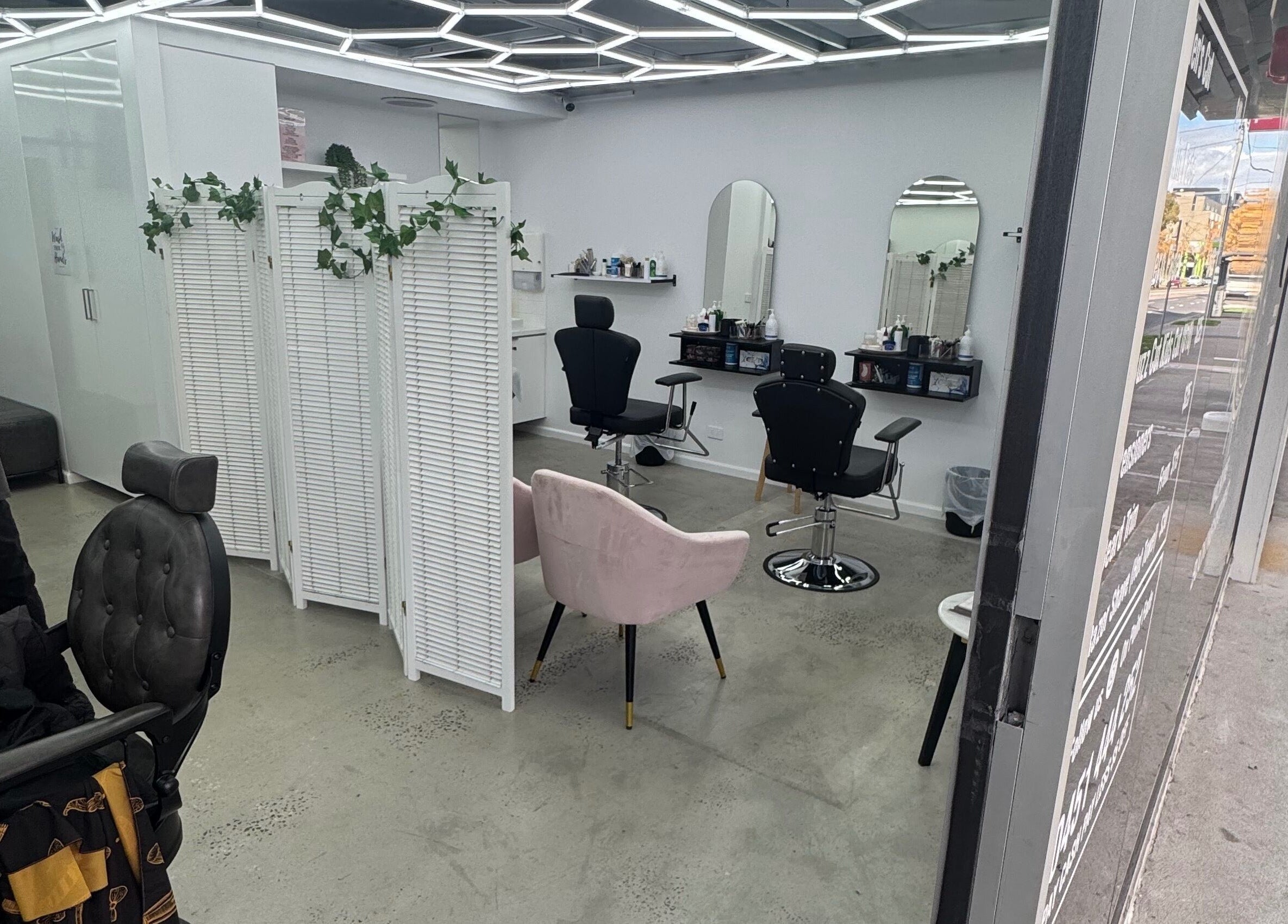 Modern interior of Brows by Sonia in Melbourne, Victoria, AU featuring stylish chairs and mirrors.