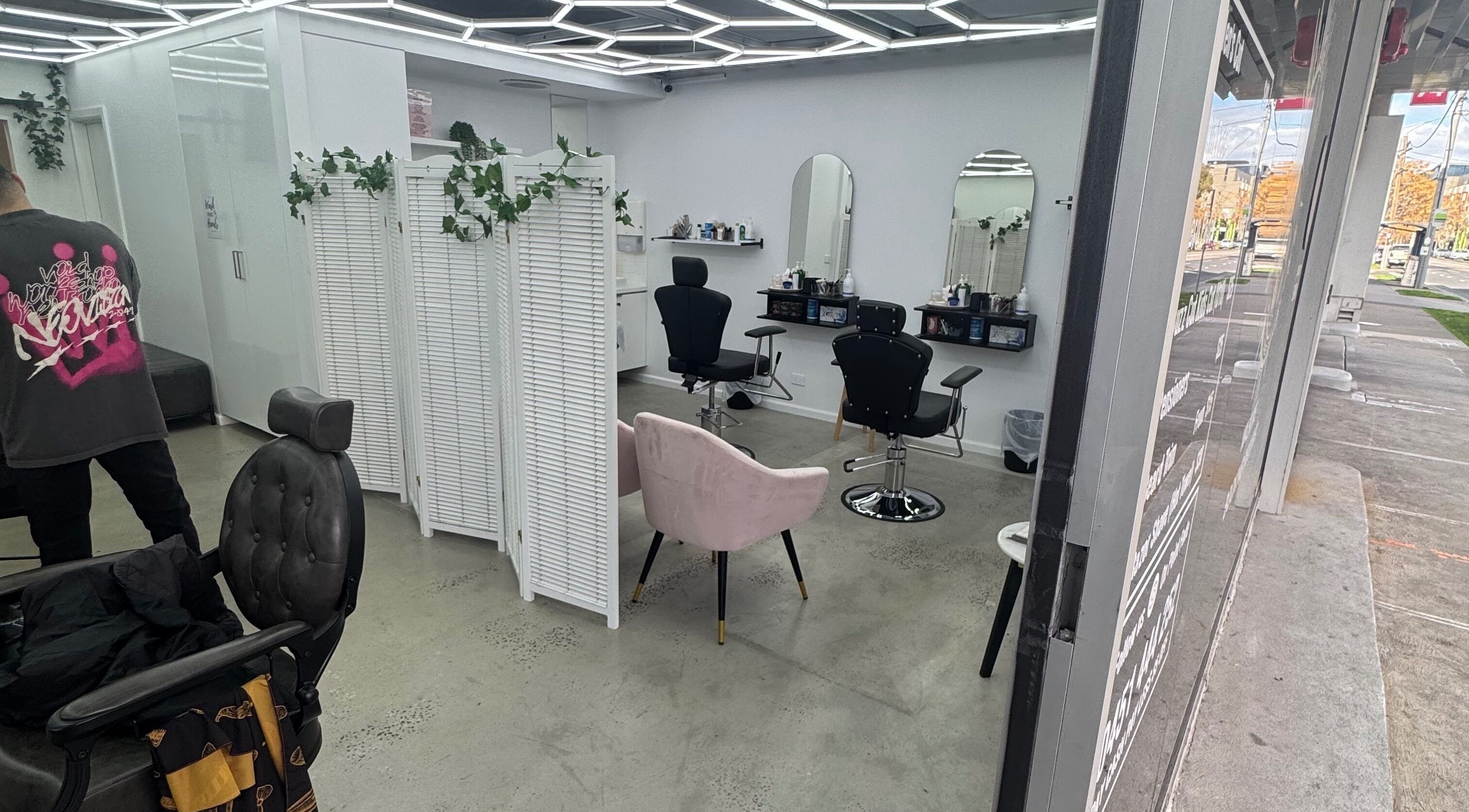 Modern interior of Brows by Sonia in Melbourne, Victoria, AU featuring stylish chairs and mirrors.