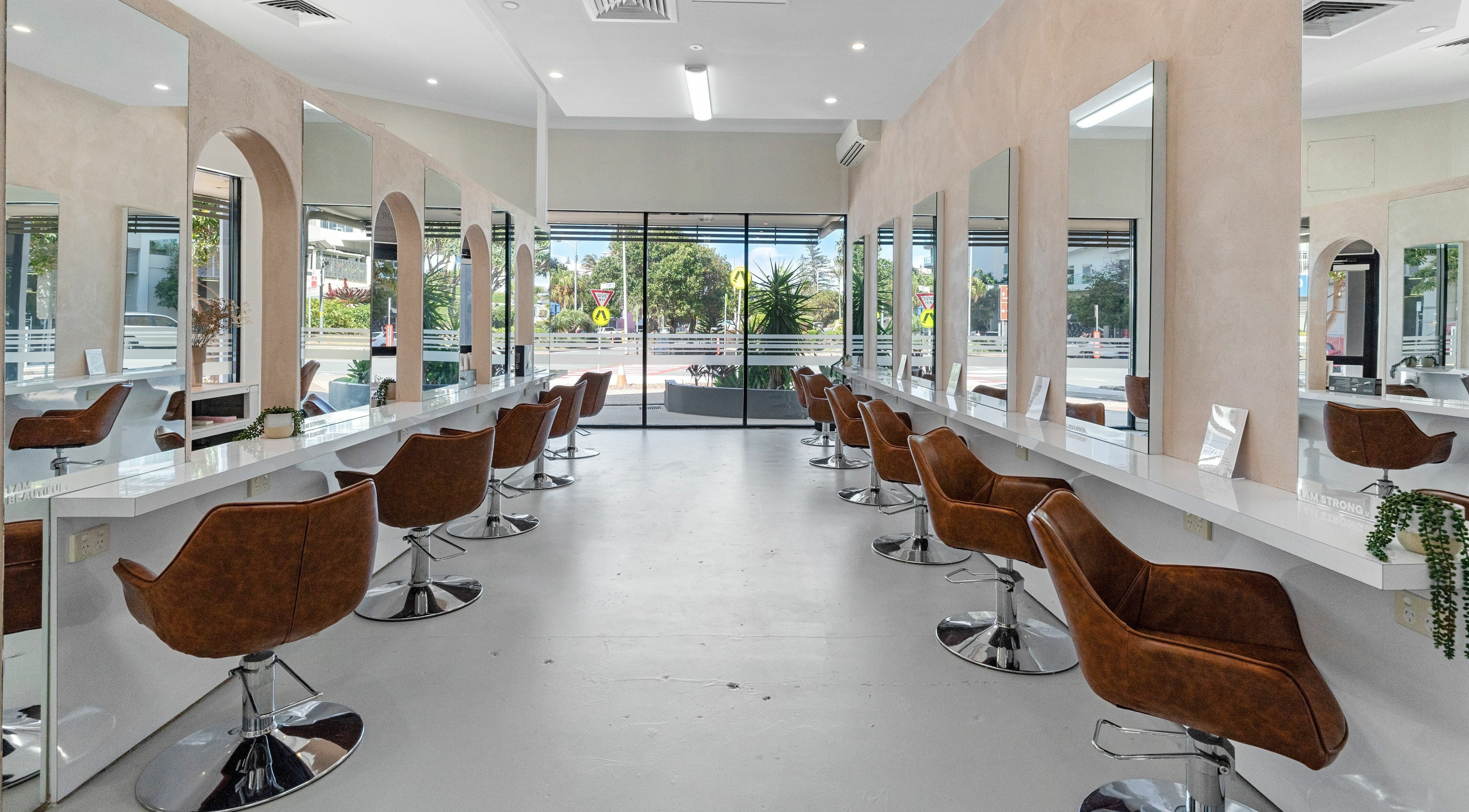Elegant salon interior at Studio Eleven - Coolangatta/Tweed, featuring stylish chairs and mirrors. Coolangatta, Queensland, AU.