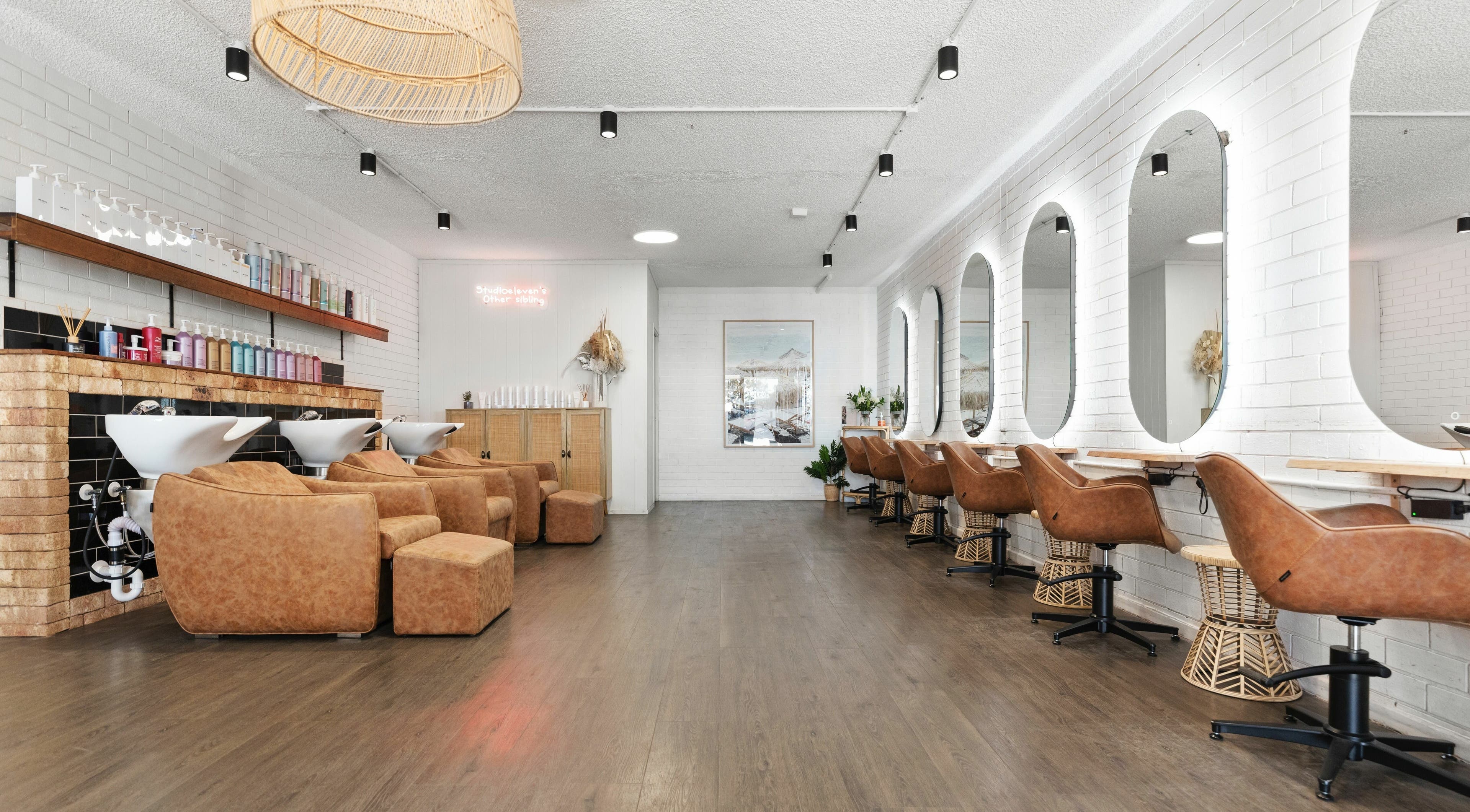 Elegant interior of Studio Eleven - Kingscliff, featuring stylish chairs and mirrors in Kingscliff, New South Wales, AU.