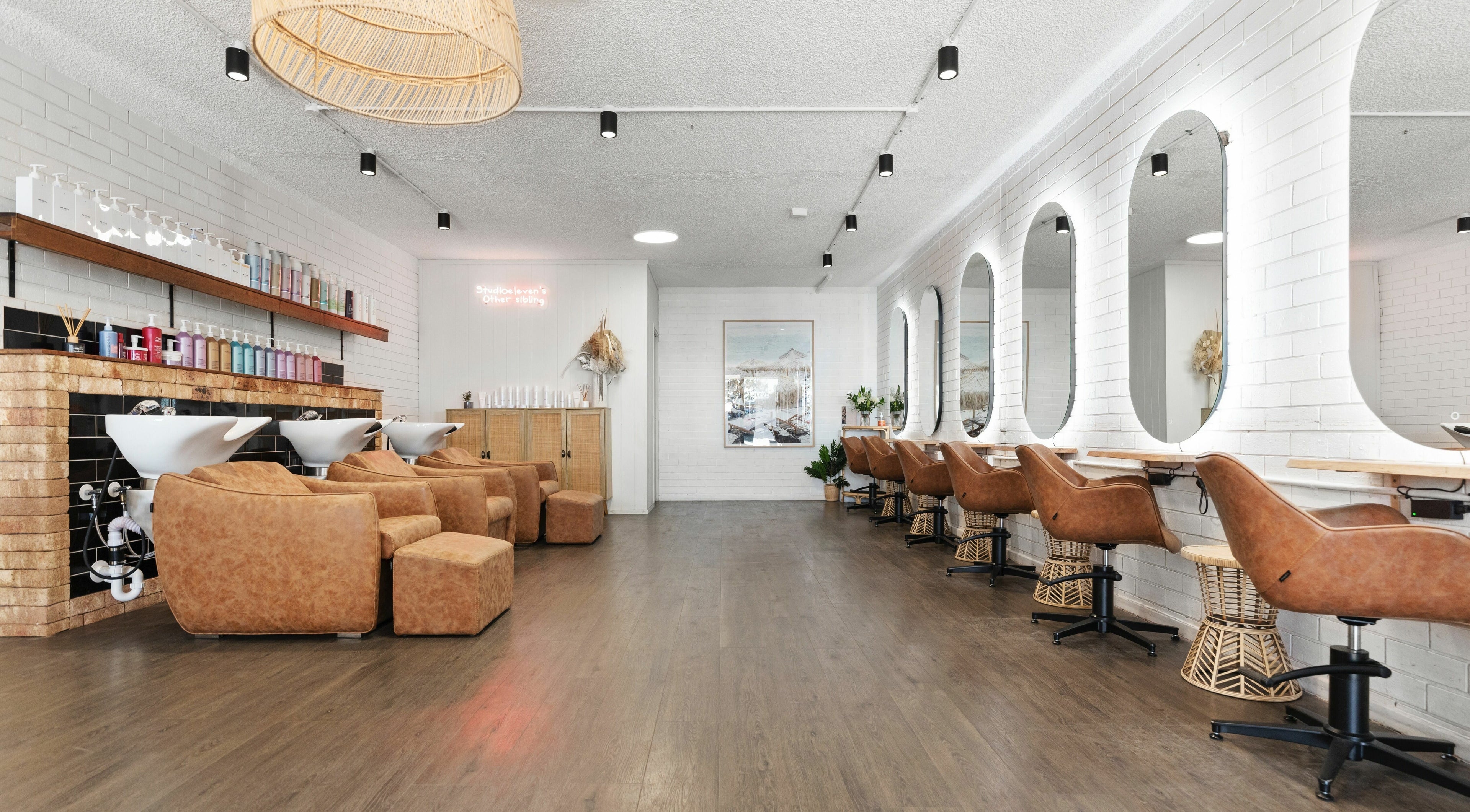 Elegant interior of Studio Eleven - Kingscliff, featuring stylish chairs and mirrors in Kingscliff, New South Wales, AU.