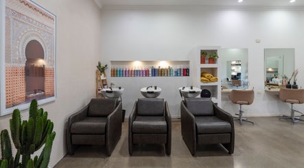 Modern interior of Studio Eleven - Banora Point with sleek salon chairs, mirrors, and product display in Banora Point, New South Wales, AU.