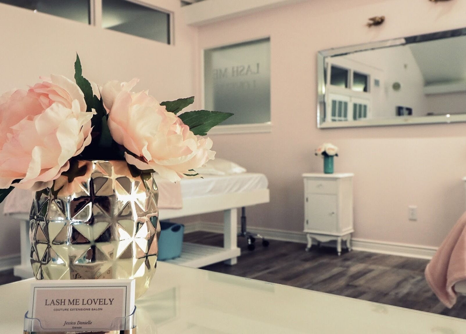 Luxurious interior of Lash Me Lovely - Couture Extensions Salon in Waterdown, Ontario, CA with floral decor.