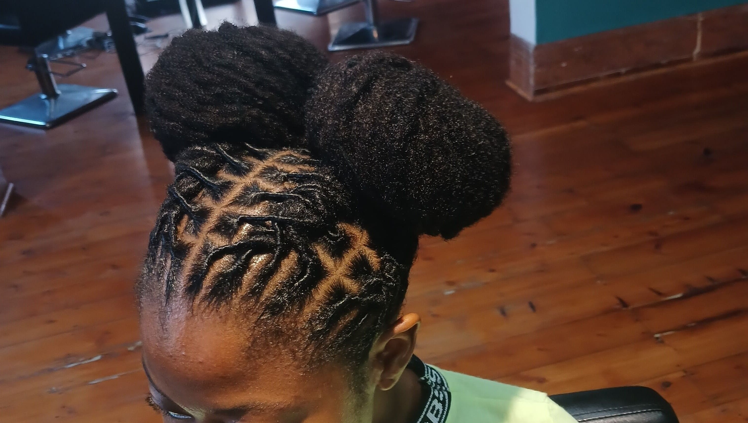 Intricate dreadlocks style at XTLS Dreadlocks Morning Side in Berea, Kwazulu-natal, ZA with polished natural look.