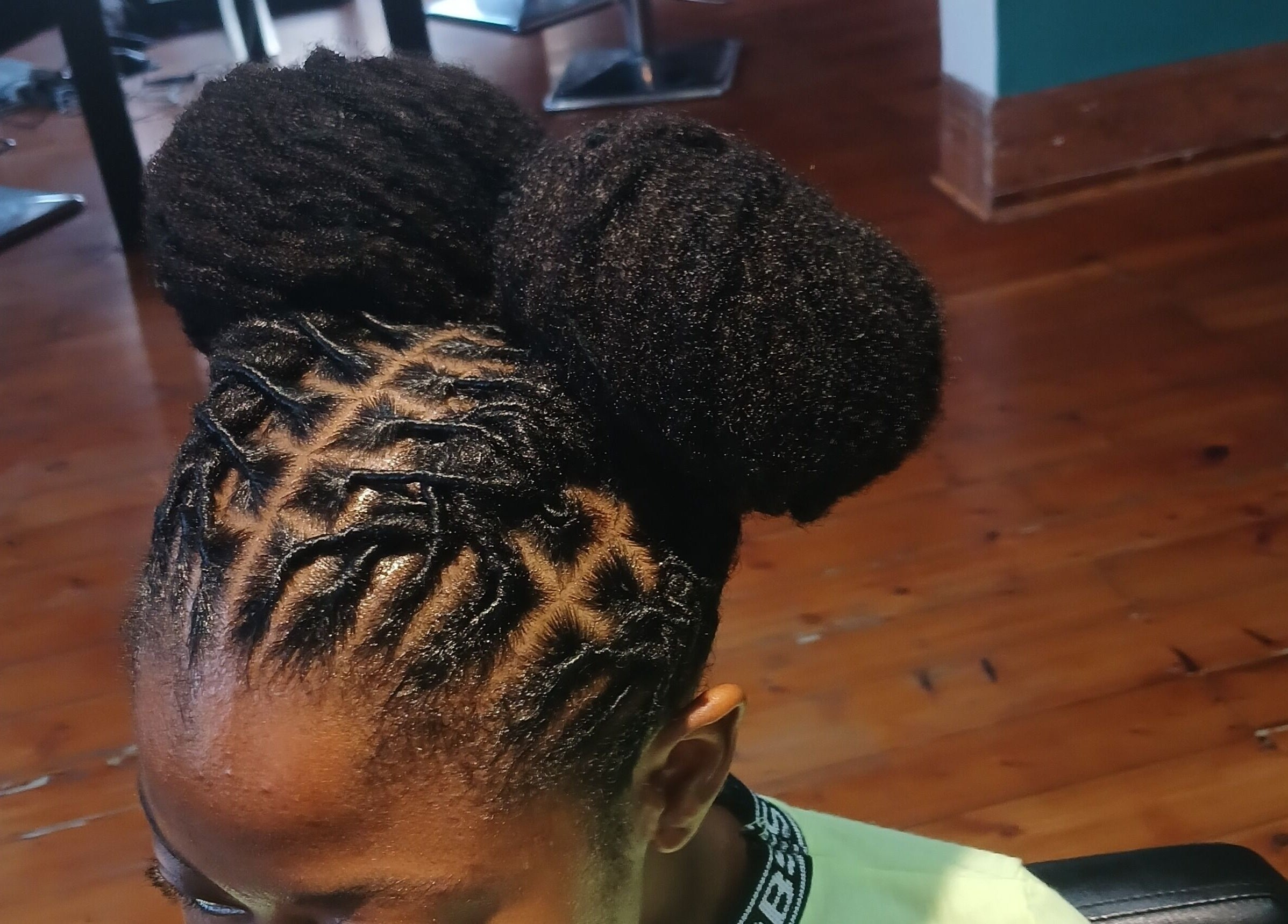Intricate dreadlocks style at XTLS Dreadlocks Morning Side in Berea, Kwazulu-natal, ZA with polished natural look.