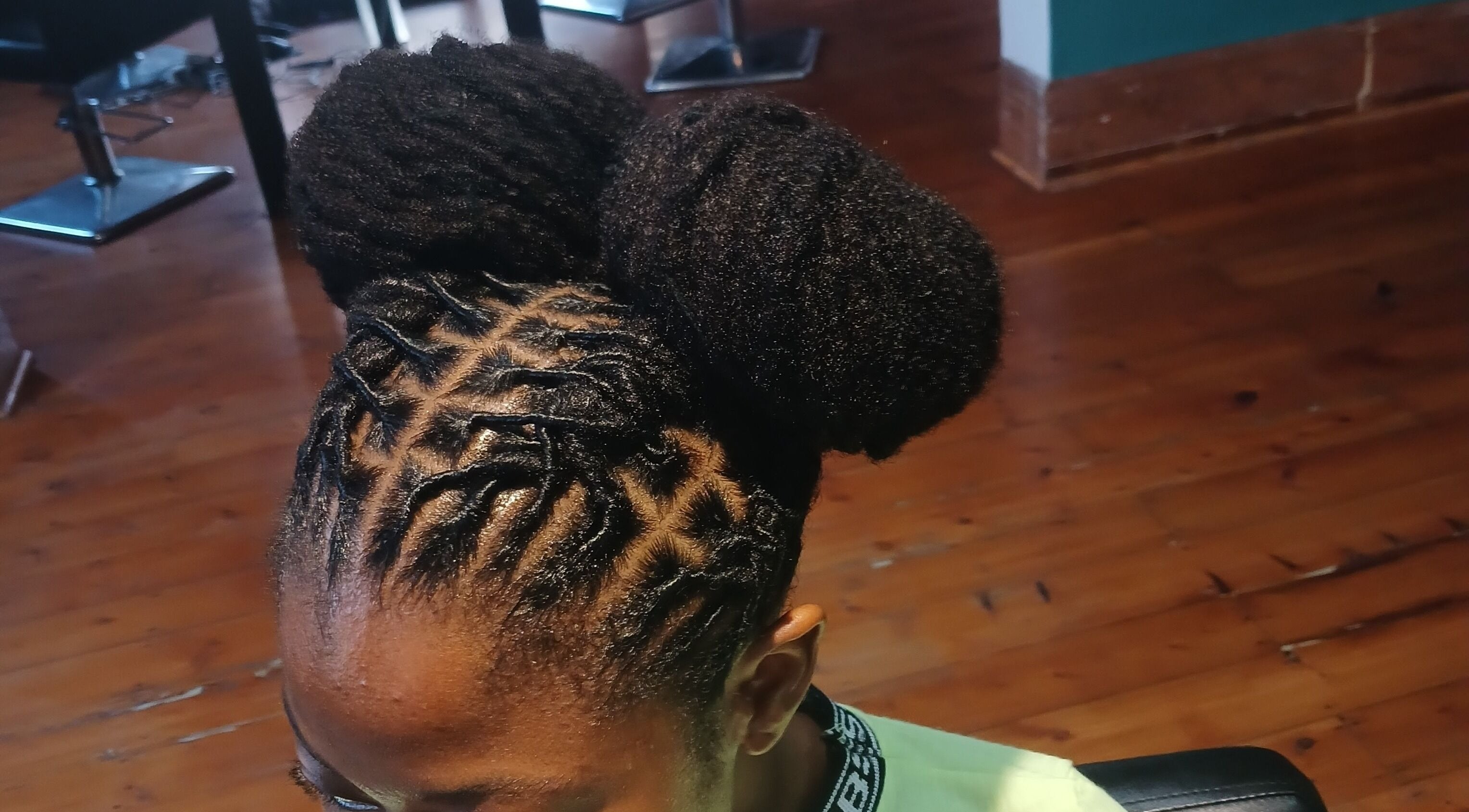 Intricate dreadlocks style at XTLS Dreadlocks Morning Side in Berea, Kwazulu-natal, ZA with polished natural look.