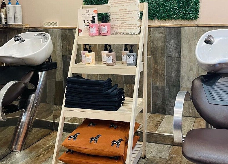 Modern salon wash stations at Cocoa Hair Design, Keynsham, England, GB, showcasing sleek design and products.