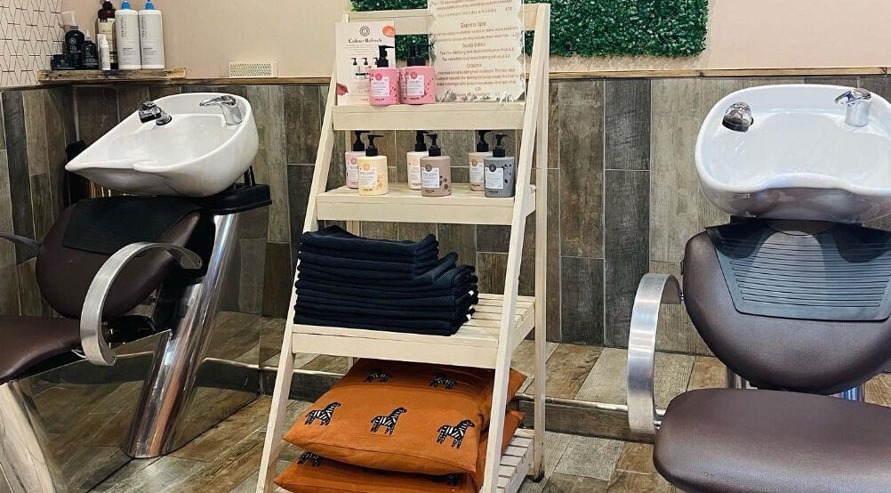 Modern salon wash stations at Cocoa Hair Design, Keynsham, England, GB, showcasing sleek design and products.