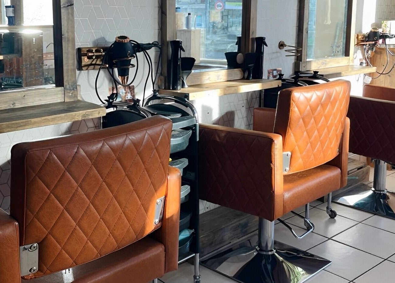 Modern salon chairs at Cocoa Hair Design in Keynsham, England, GB offering a stylish setting.