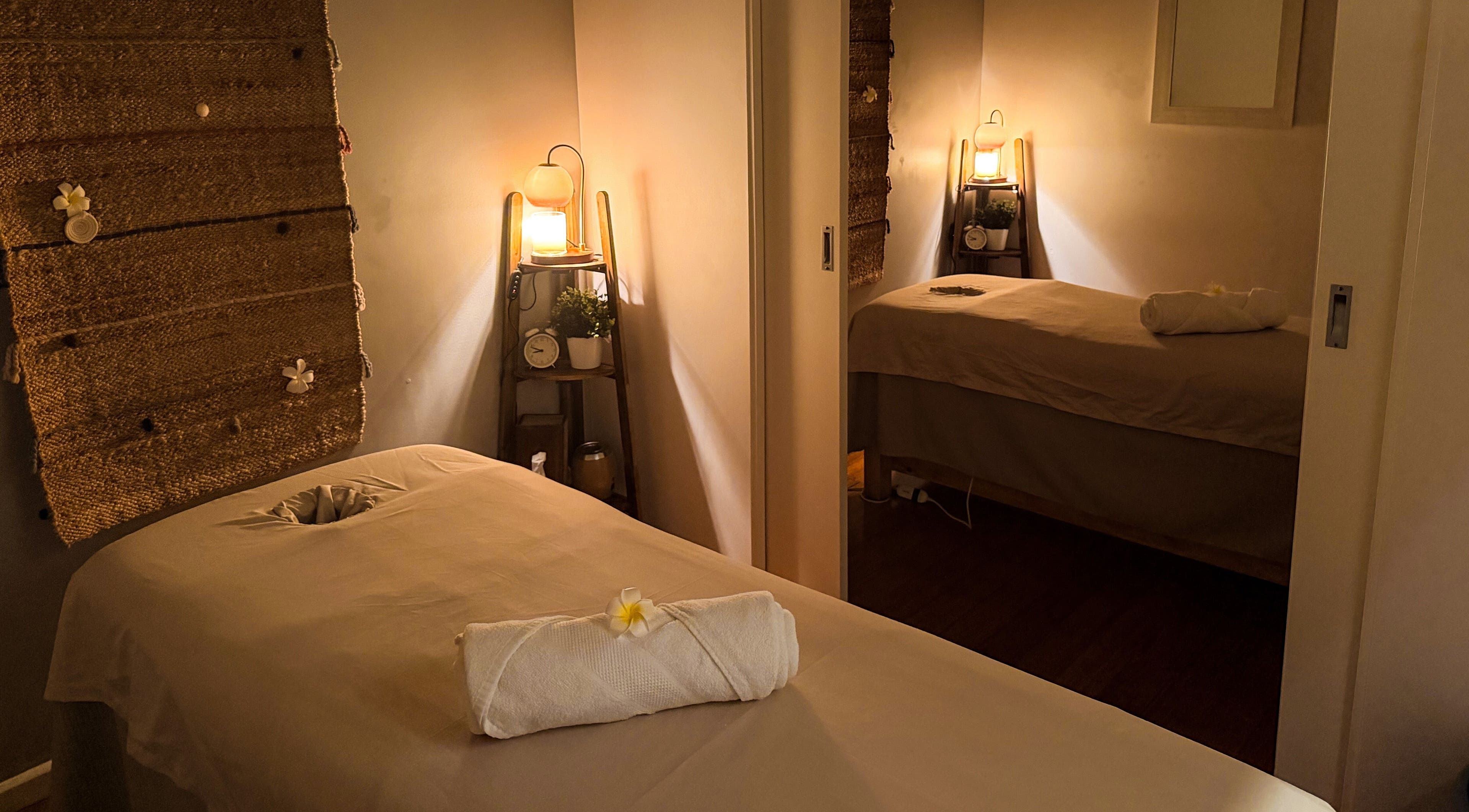 Calming massage room at Natural Thai Massage & Skincare, Melbourne, Victoria, AU, with soft lighting and decor.
