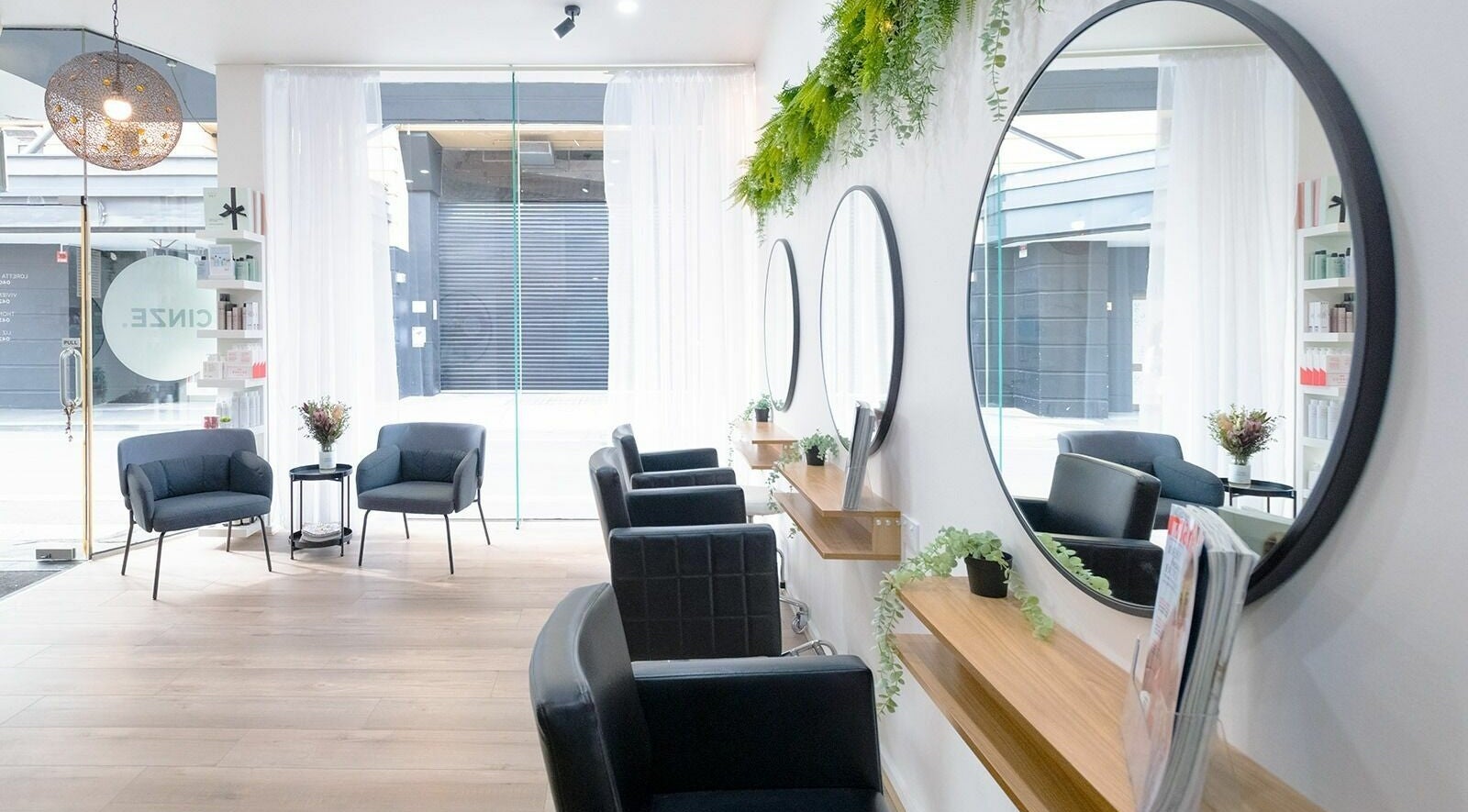Modern salon interior with seating and mirrors at Cinze Hairdressing, Prahran, Victoria, AU.