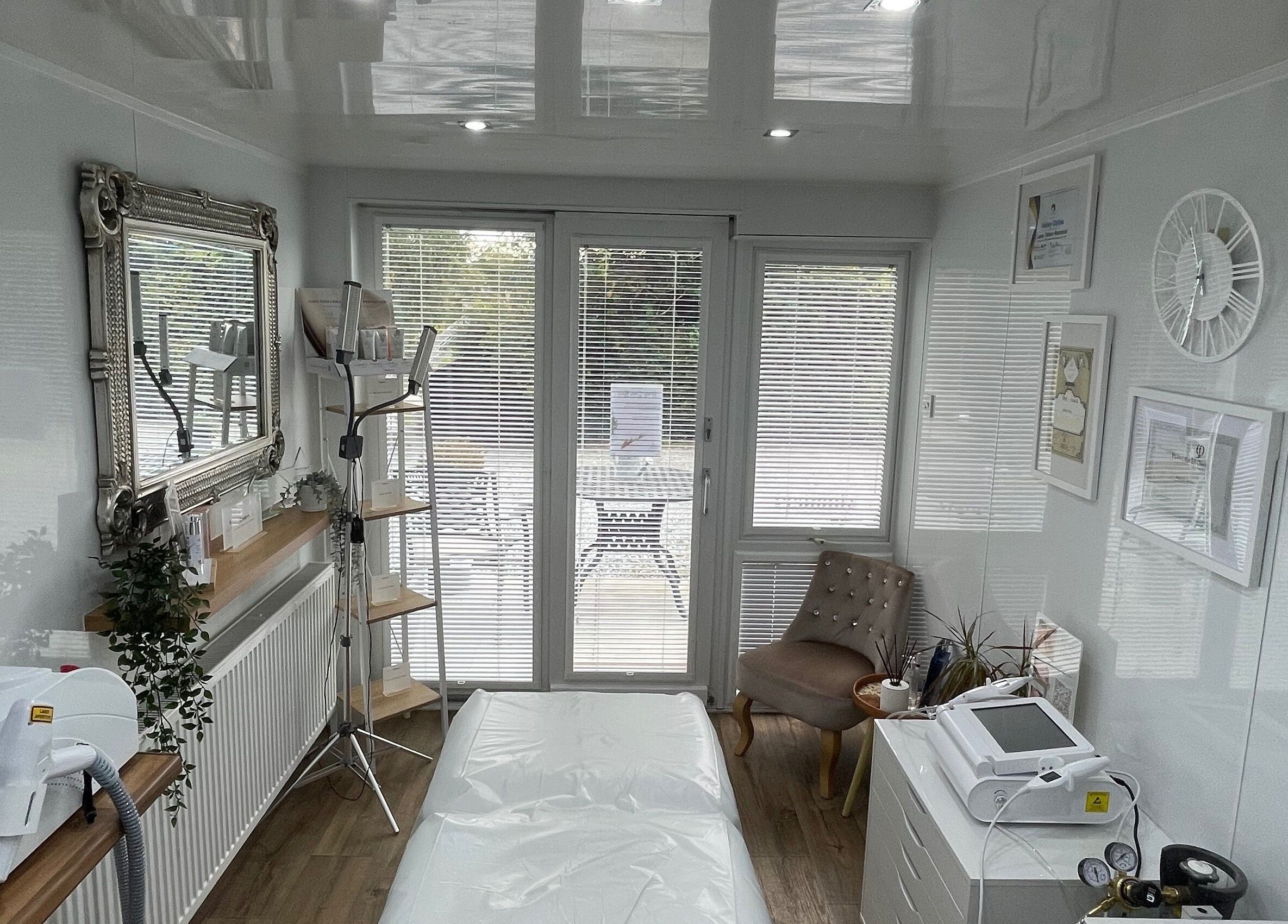 Modern treatment room at Hailey Dallas Brows, Lhanbryde, Scotland, GB featuring chic decor and advanced equipment.