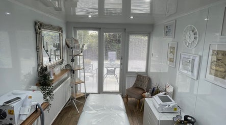 Modern treatment room at Hailey Dallas Brows, Lhanbryde, Scotland, GB featuring chic decor and advanced equipment.