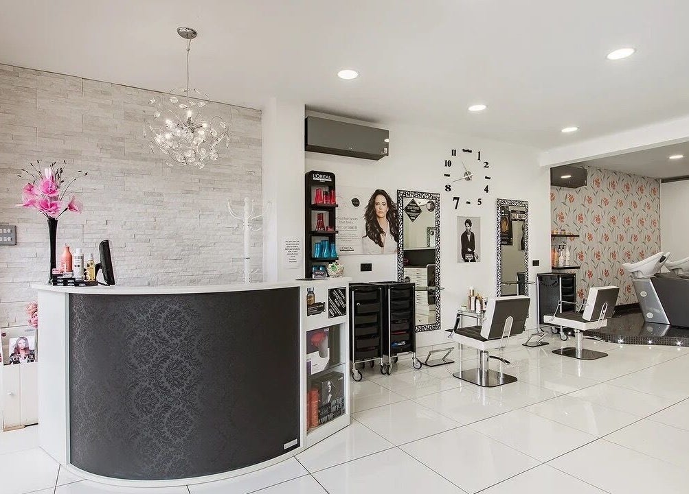 Modern interior of Reflection Hair Studio in Potters Bar, England, GB, showcasing elegant salon design.