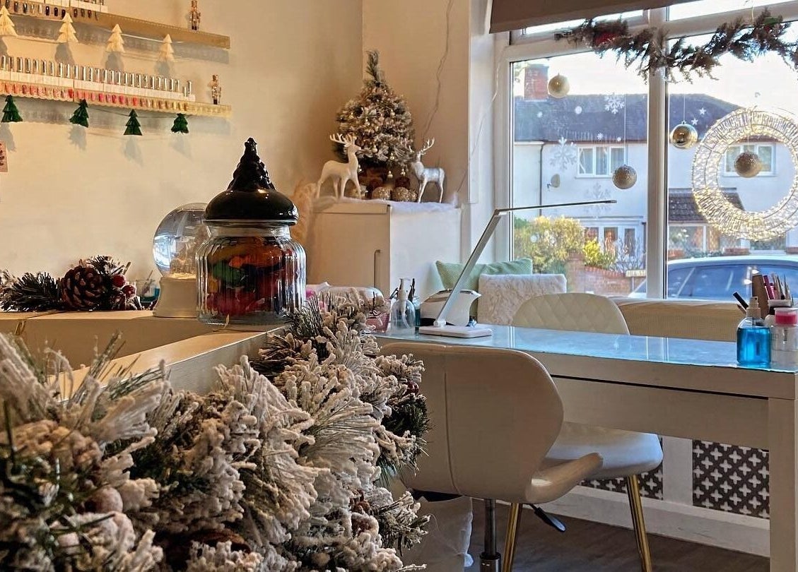 Festive decorations at The Chi Rooms, Essington, England, GB enhance the cozy beauty salon atmosphere.