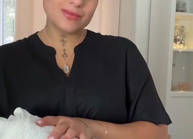 Therapist at Leyla’s Holistic Therapies, St Albans, preparing for a spa session with a towel.