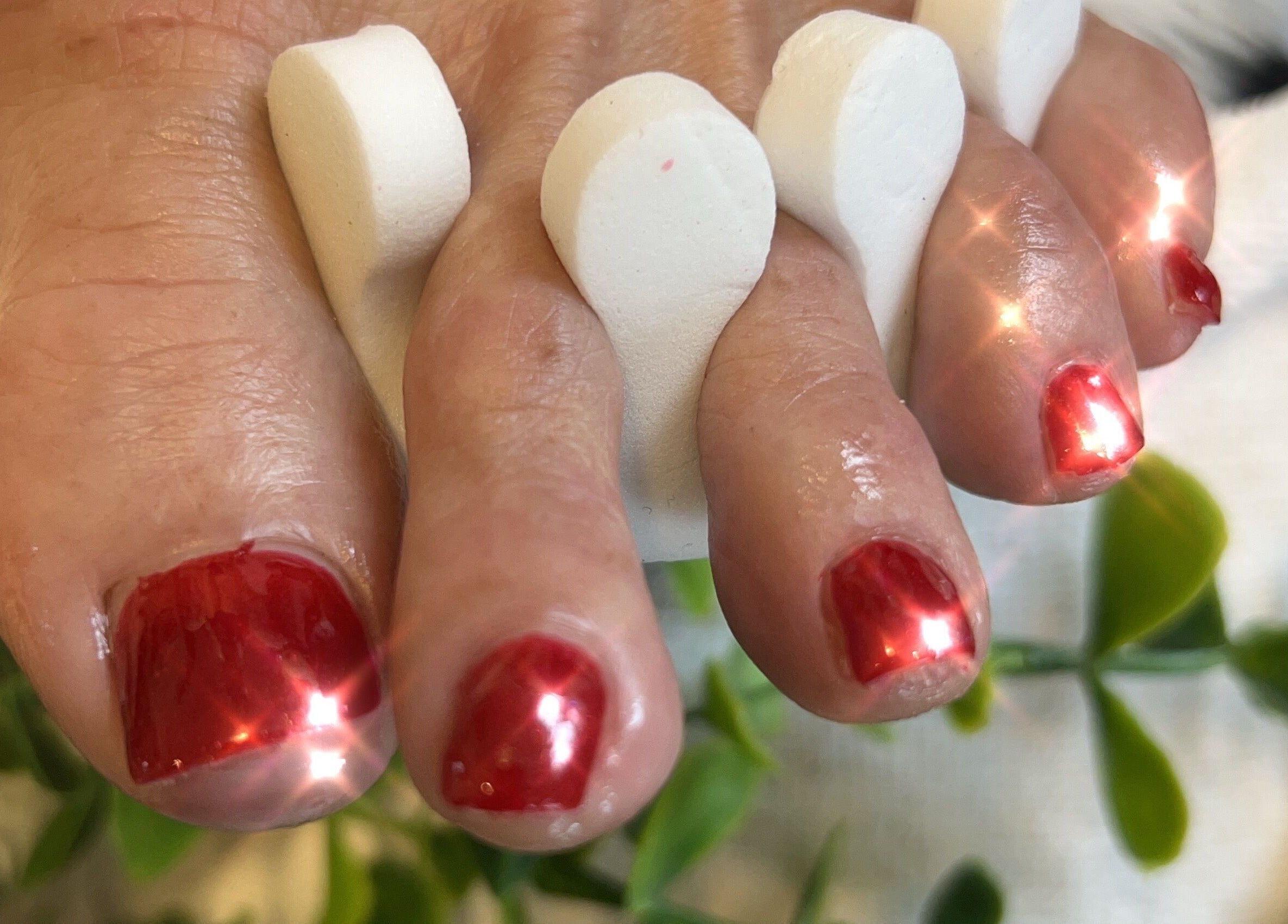 Elegant red pedicure at Radiance by Raytillia Salon and Mini Spa, Brunswick, Georgia, US, showcasing luxury care.