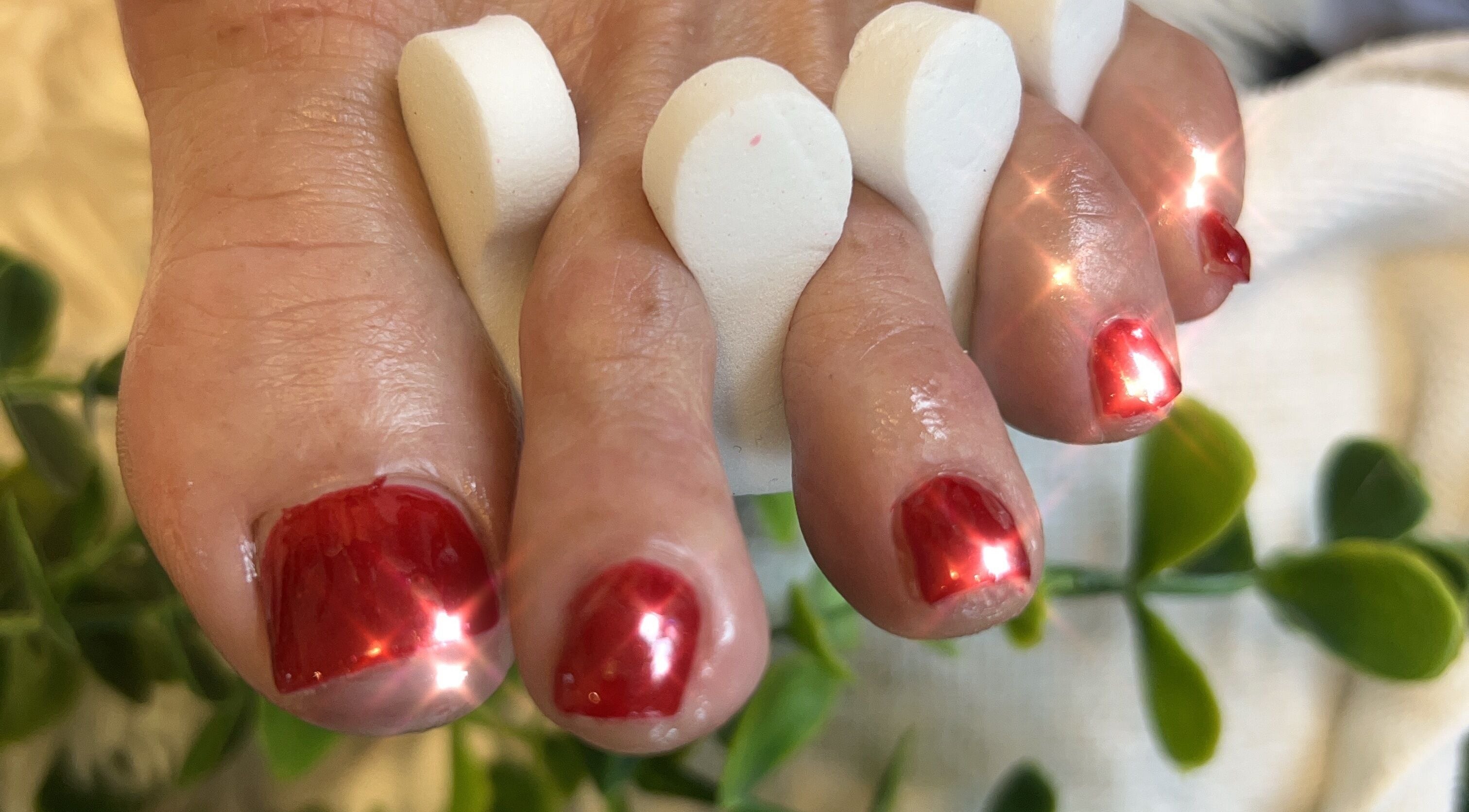 Elegant red pedicure at Radiance by Raytillia Salon and Mini Spa, Brunswick, Georgia, US, showcasing luxury care.