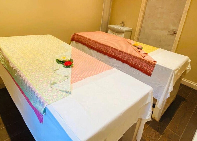 Relaxing massage room at Refresh and Spa Ltd, London, England, GB, showcasing twin tables with elegant decor.