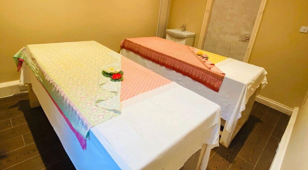 Relaxing massage room at Refresh and Spa Ltd, London, England, GB, showcasing twin tables with elegant decor.