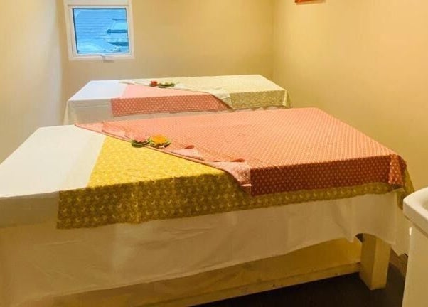 Cozy therapy room with two massage tables at Refresh and Spa Ltd, London, England, GB.