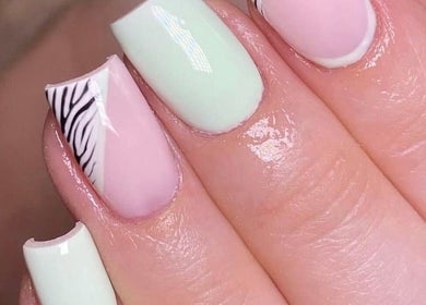 Chic nail art at Savannah Sky Salon in Neyland, Wales, GB, featuring pastel colors and zebra patterns.
