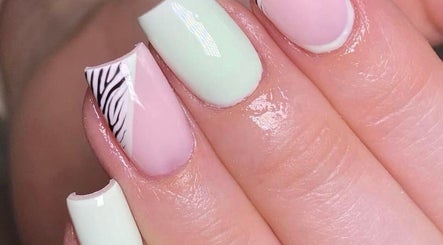 Chic nail art at Savannah Sky Salon in Neyland, Wales, GB, featuring pastel colors and zebra patterns.