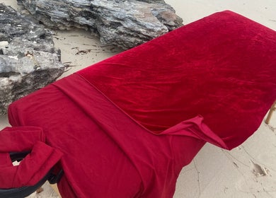 Massage table with red cover at Body and Skin Treatments by Michelle, Nassau, New Providence, BS.