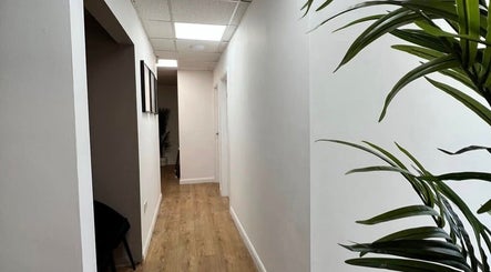 Hallway with plants at Face Me Aesthetics, Arborfield Green, England, GB.