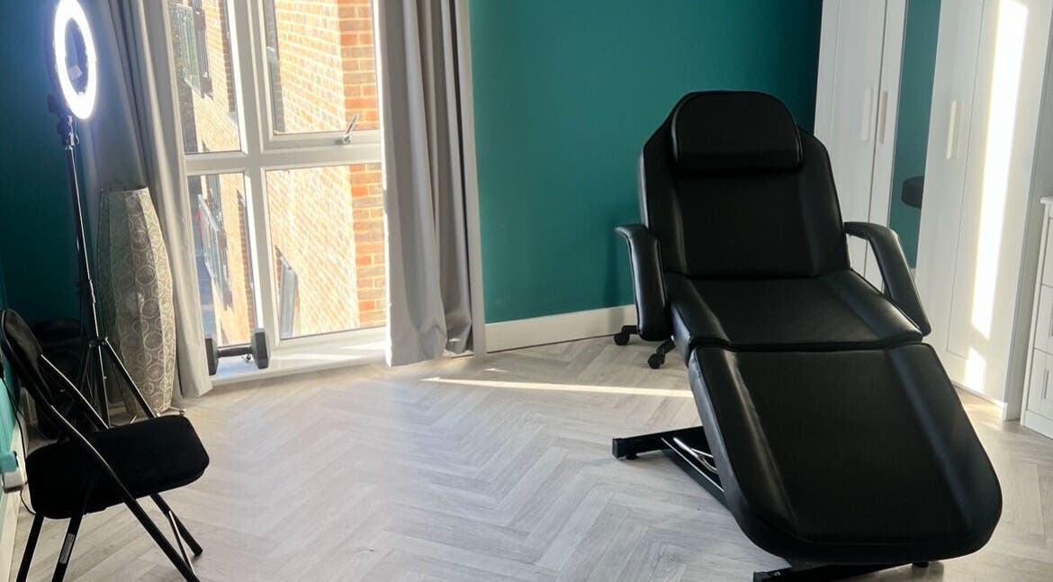 Bright treatment room at The Nurse Injector, Arborfield Green, with comfy chair and large window.