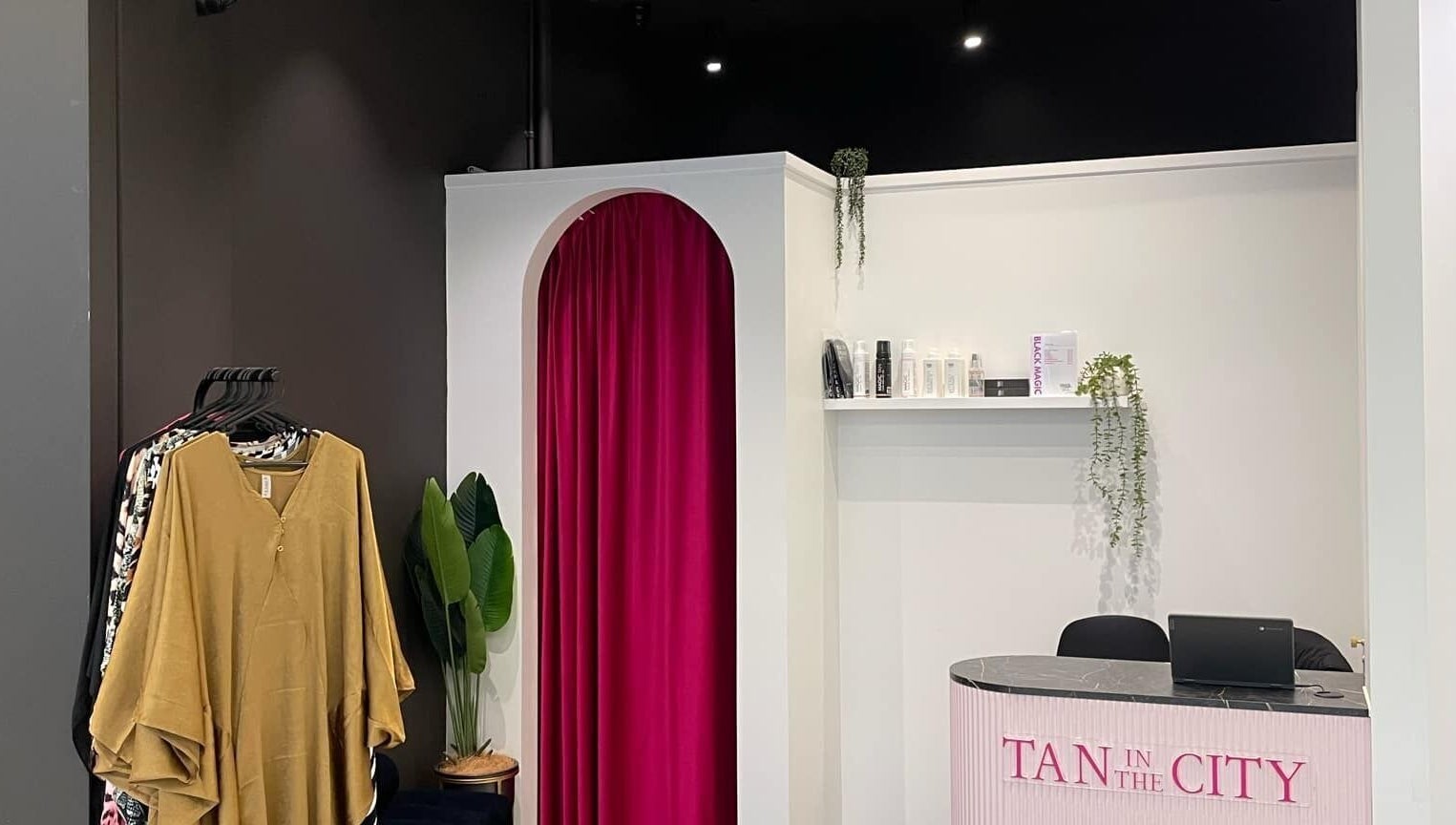 Reception area at Tan In The City Dunedin with stylish decor, located in Dunedin, Otago Region, NZ.