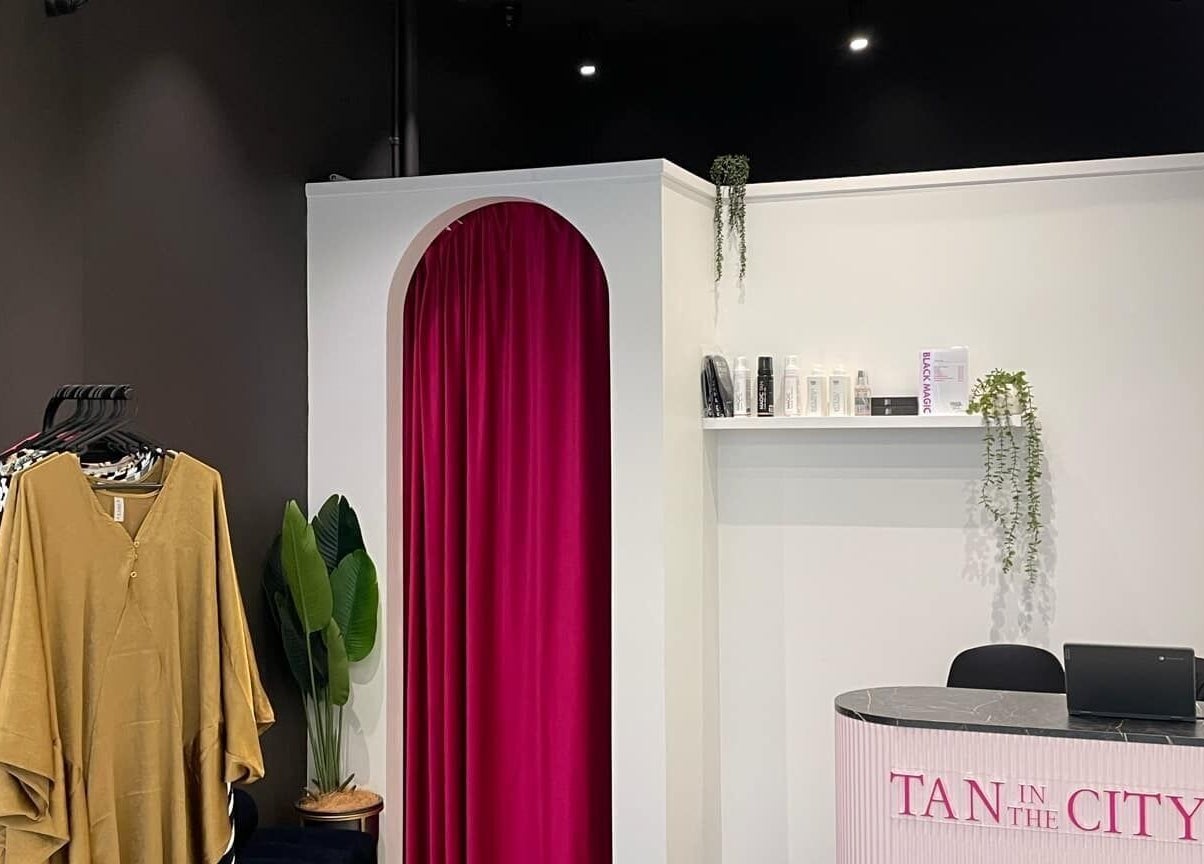 Reception area at Tan In The City Dunedin with stylish decor, located in Dunedin, Otago Region, NZ.