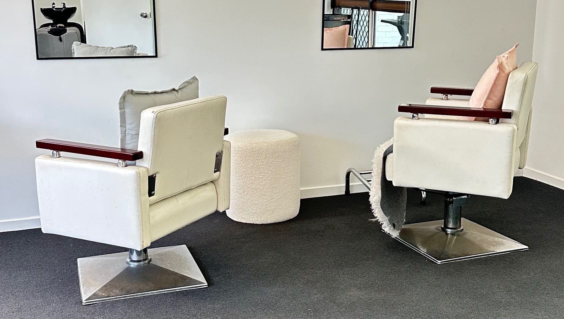 Modern salon chairs at Dreamy Looks By Kara, Ashmore, Queensland, AU offer comfort and style.