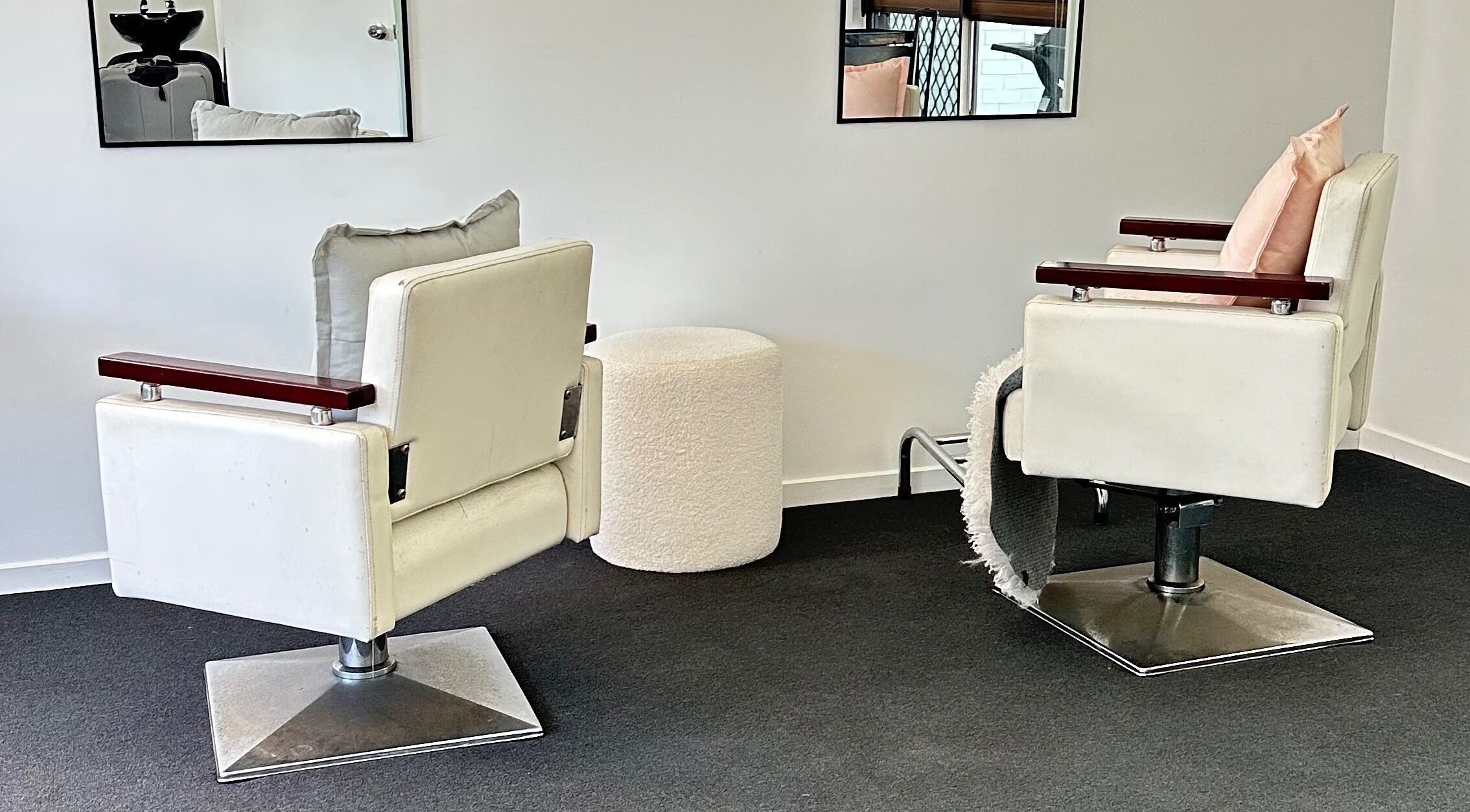 Modern salon chairs at Dreamy Looks By Kara, Ashmore, Queensland, AU offer comfort and style.